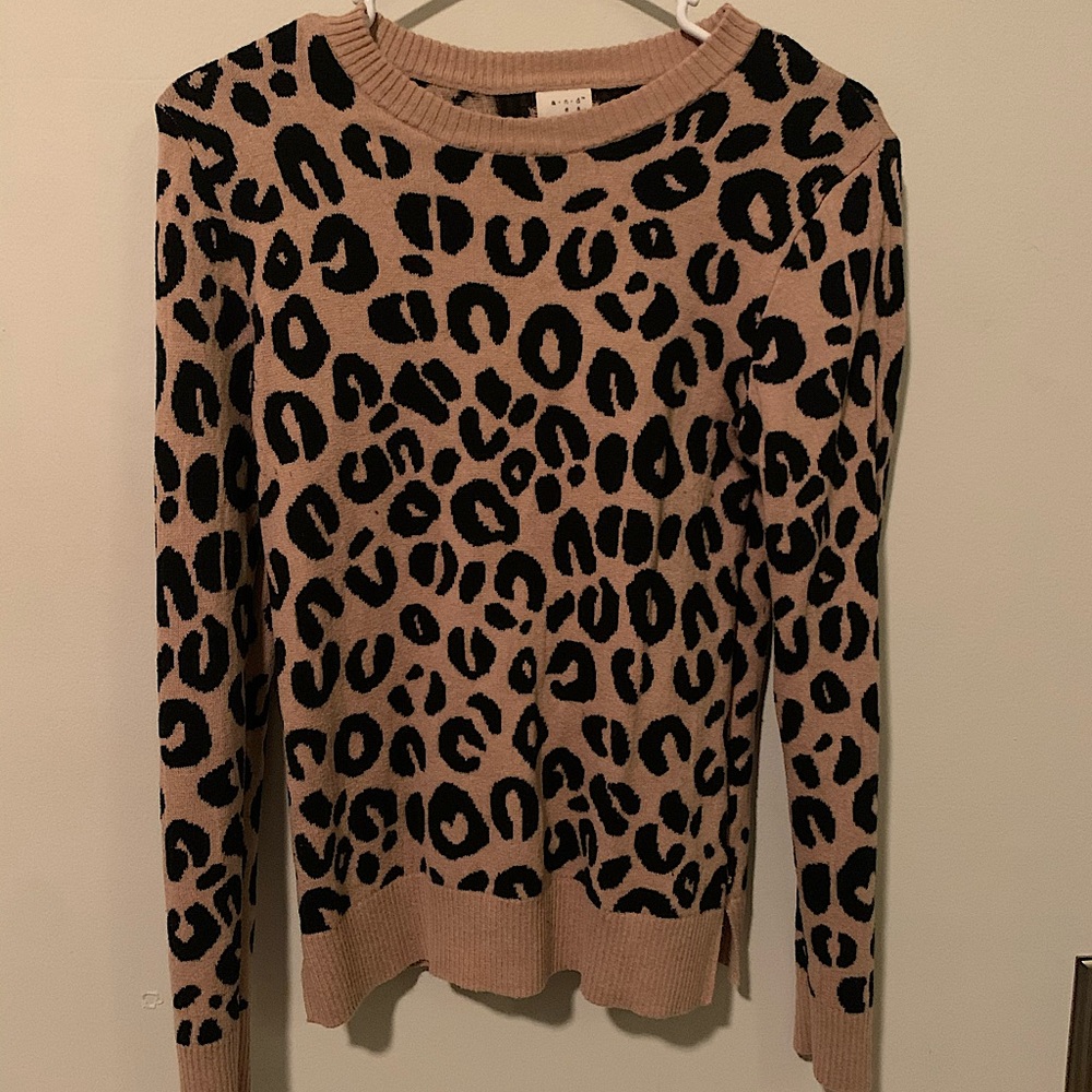 Cheetah print round neck sweater. Lightly worn